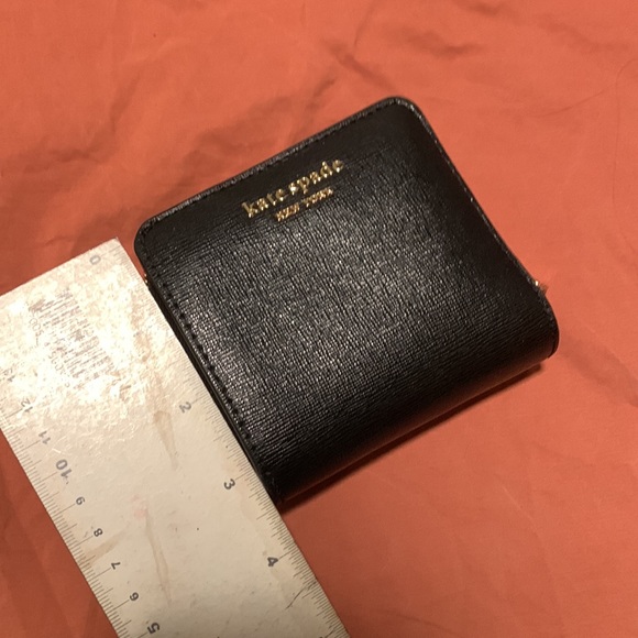 Morgan Small Compact Wallet
Kate Spade black leather wallet
3.75"h x 4"w x1.3" - Picture 7 of 7